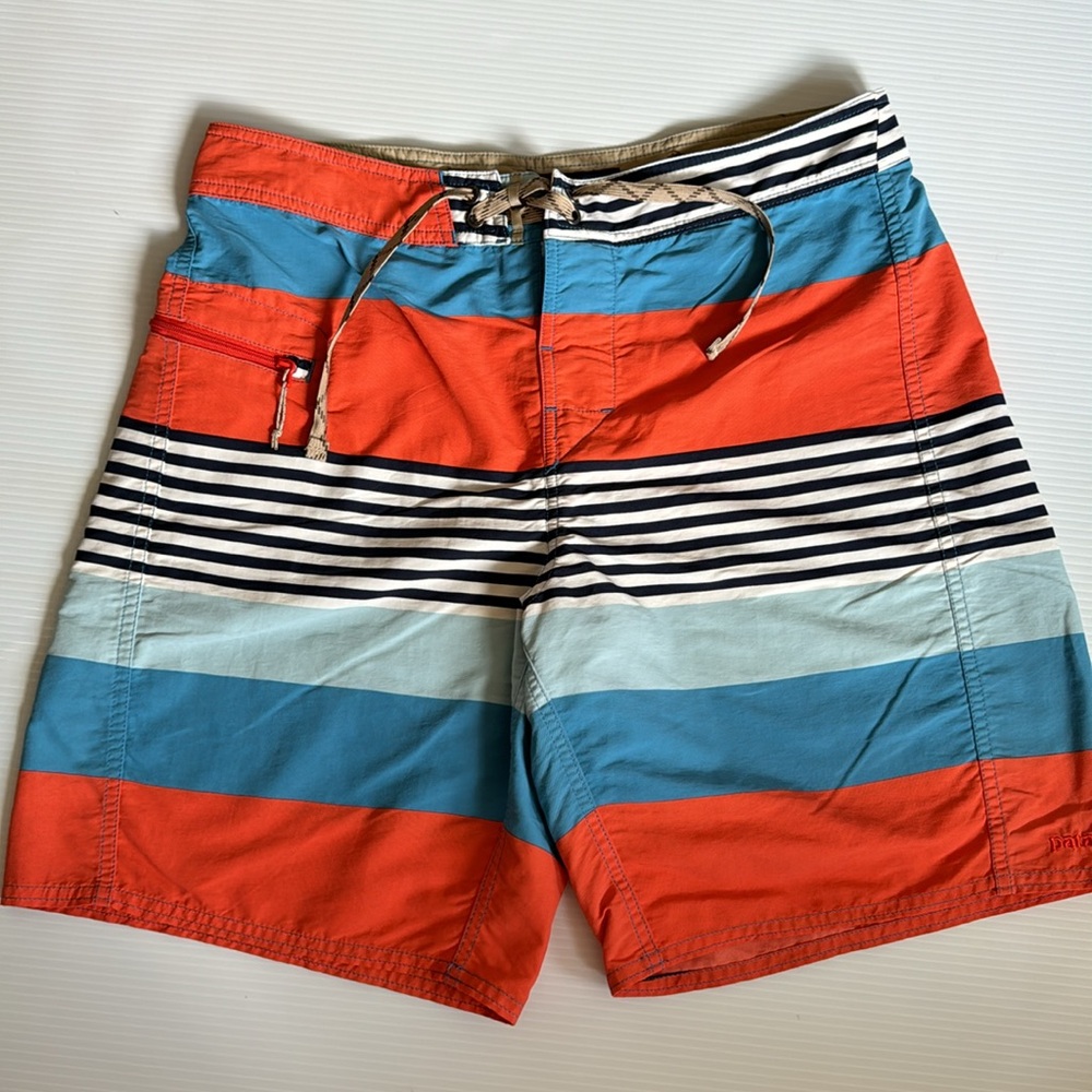 Patagonia orange, blue & white striped men’s board shorts.  Size 32